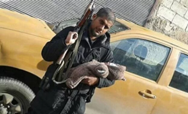 Indian-origin ISIS member poses with AK-47 and his newborn, posts picture on Twitter