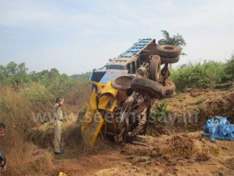 Sand laden lorry topples: Driver injured