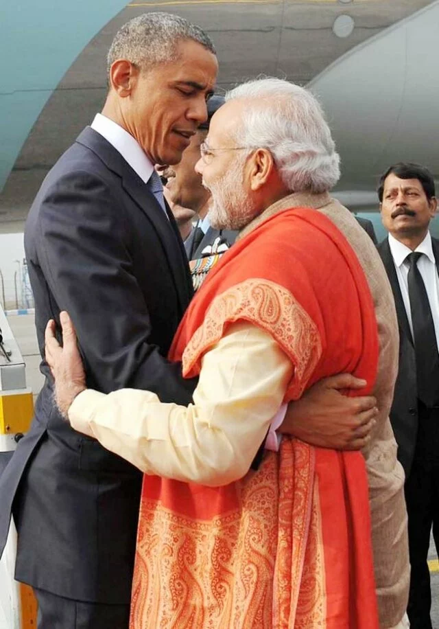 Obamas land in Delhi, welcomed by Modi